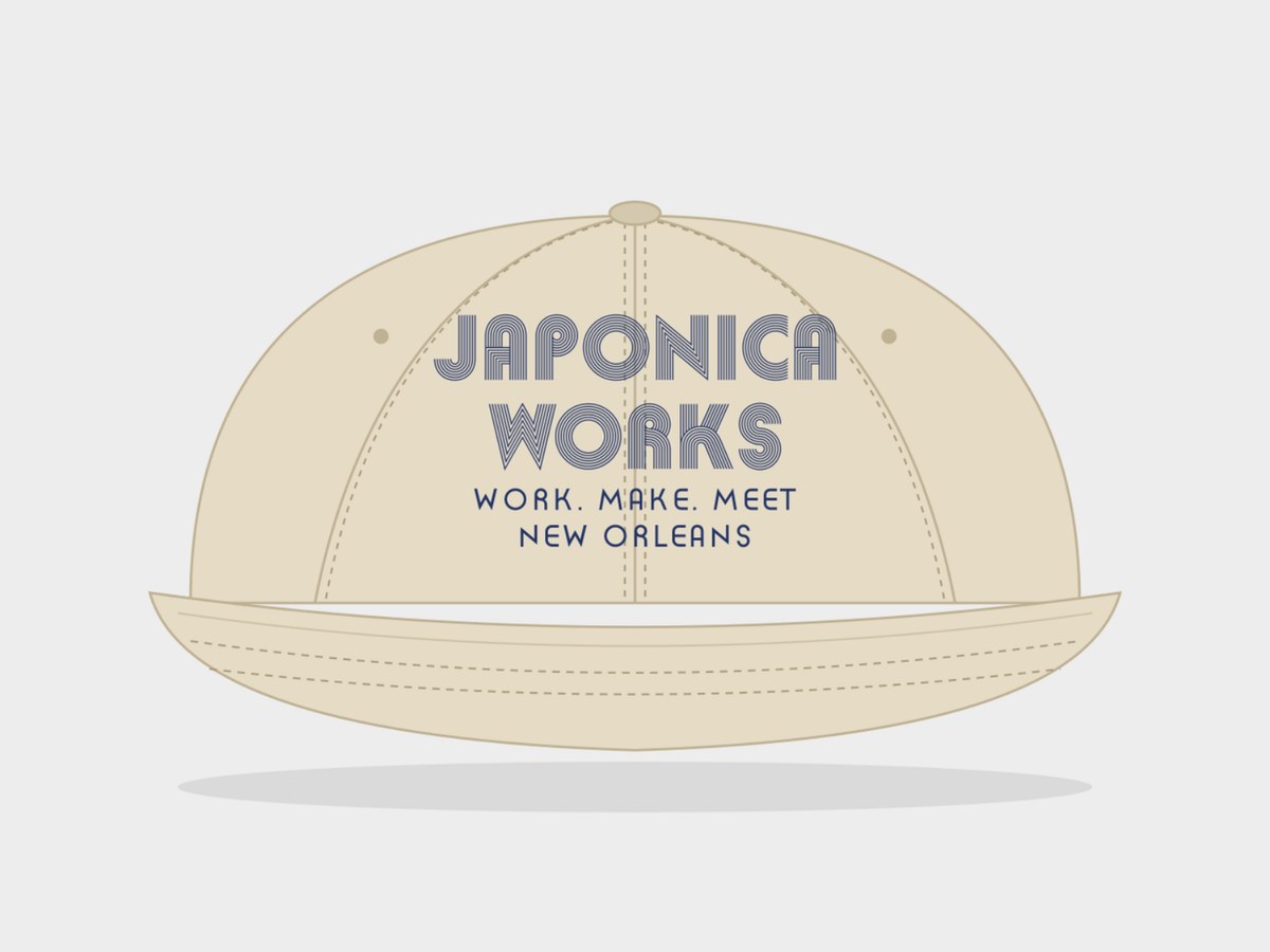 Cream baseball cap embroidered with the Japonica Works logo, Work. Make. Meet. and New Orleans.